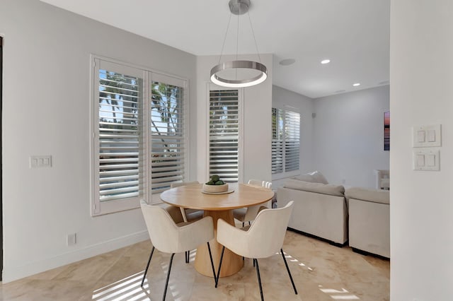 tiled dining area with a healthy amount of sunlight