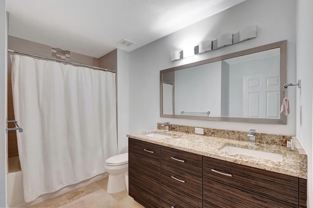 full bathroom featuring shower / bath combo, vanity, and toilet