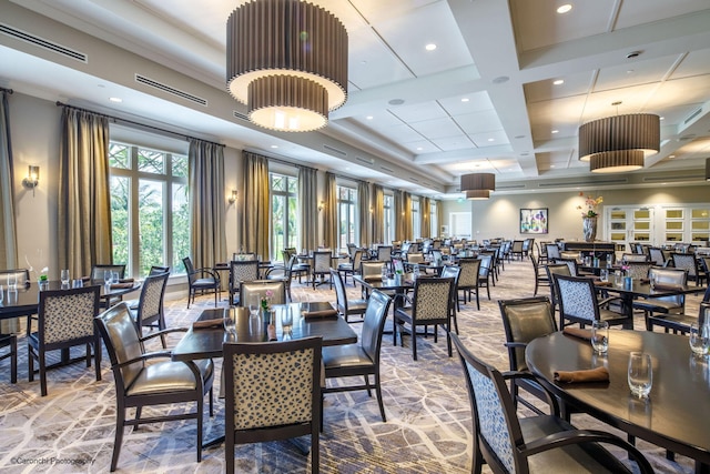 dining area featuring beam ceiling and coffered ceiling