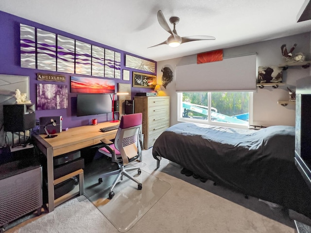 bedroom featuring light colored carpet and ceiling fan