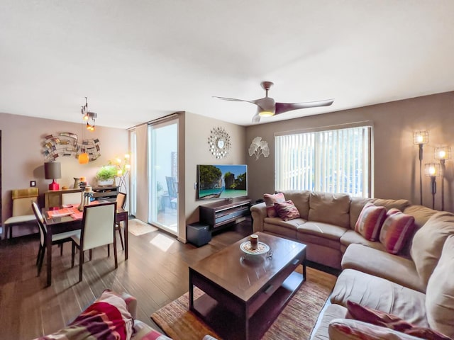 living room with ceiling fan and light wood-type flooring