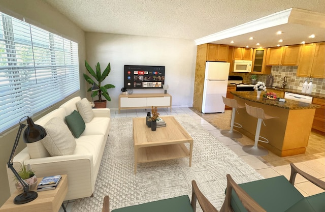 tiled living room featuring a textured ceiling and sink