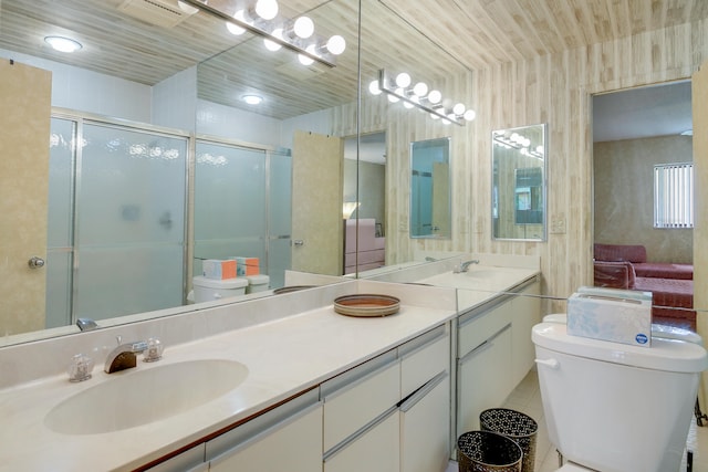 bathroom with vanity with extensive cabinet space, wooden ceiling, tile flooring, dual sinks, and toilet