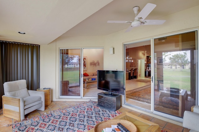 tiled living room featuring ceiling fan