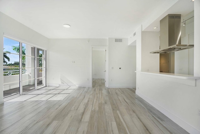 empty room with light hardwood / wood-style floors