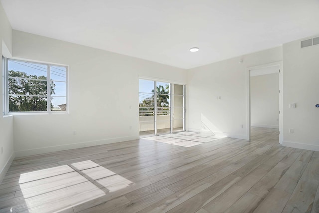 unfurnished room featuring light hardwood / wood-style flooring