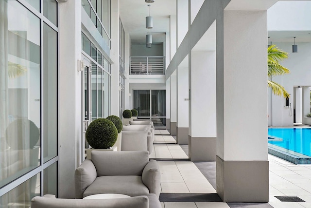 view of patio / terrace with a community pool and an outdoor hangout area