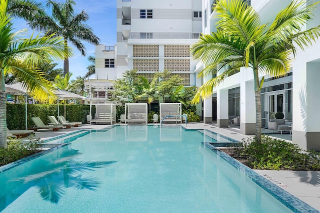 view of swimming pool with a patio