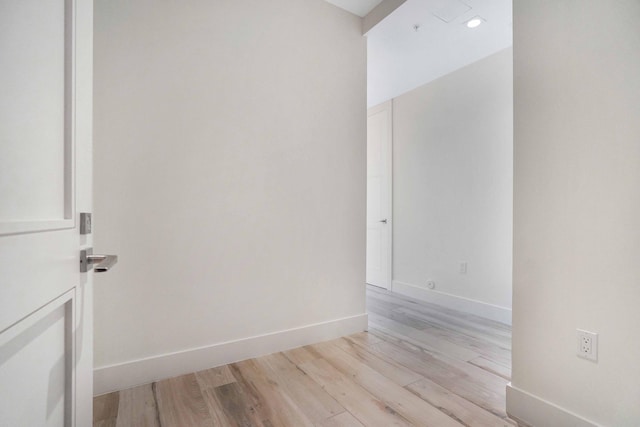 unfurnished room with light hardwood / wood-style floors