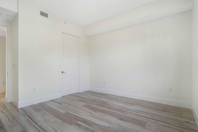 spare room featuring light hardwood / wood-style floors