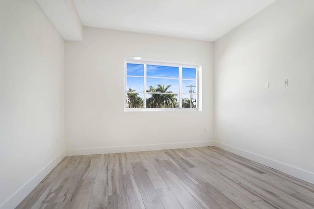 spare room featuring light hardwood / wood-style floors