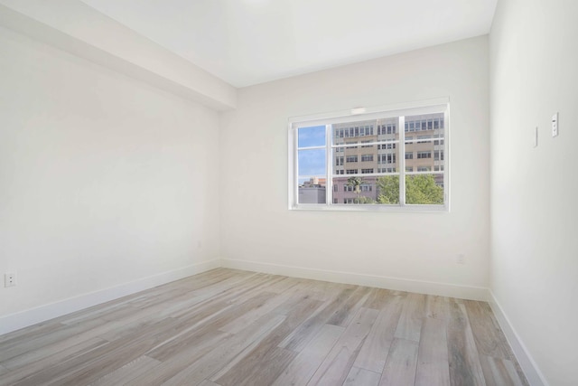 spare room featuring light hardwood / wood-style floors