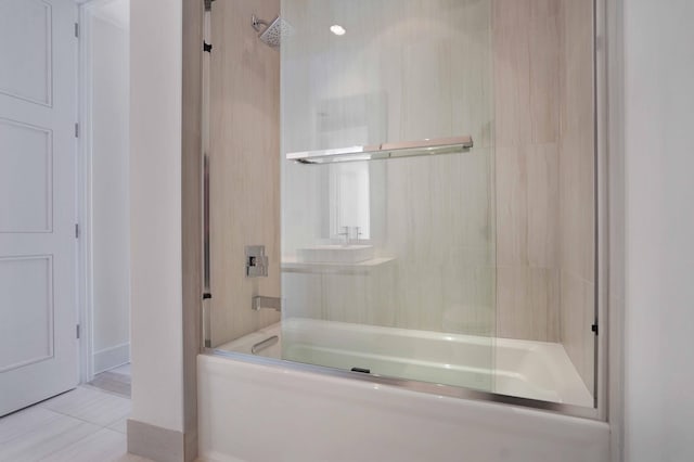 bathroom with tile patterned floors and enclosed tub / shower combo