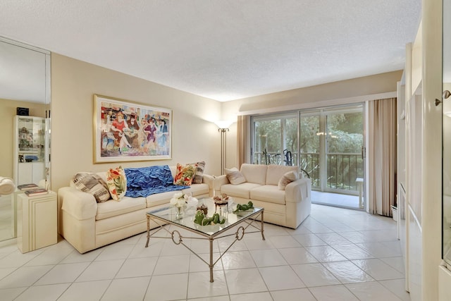 living room featuring light tile patterned flooring and a textured ceiling