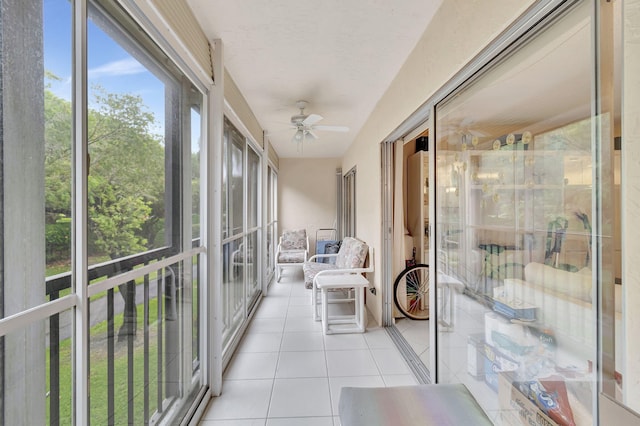 sunroom featuring ceiling fan