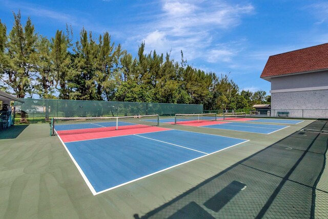 view of sport court with basketball hoop