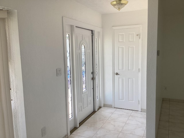 view of tiled foyer entrance