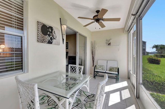 sunroom with a healthy amount of sunlight and ceiling fan