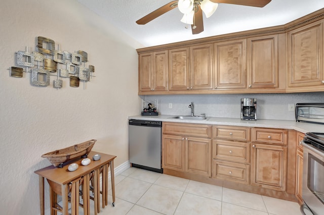 kitchen with sink, ceiling fan, light tile floors, stove, and stainless steel dishwasher