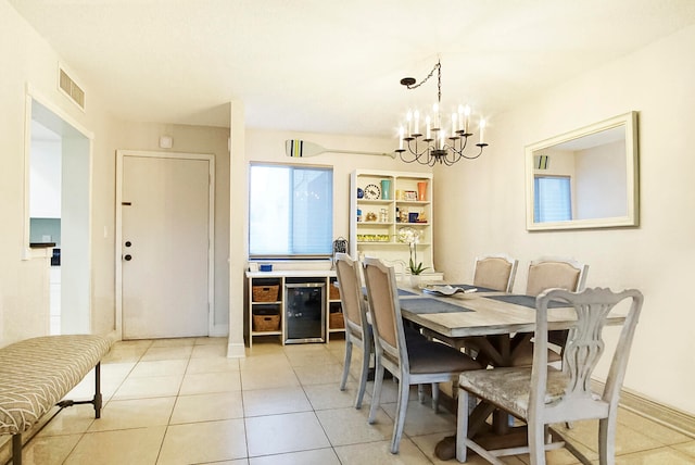 tiled dining space featuring a notable chandelier