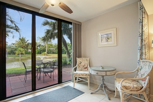 sitting room with light tile flooring and ceiling fan