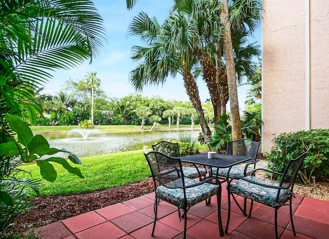 view of patio with a water view