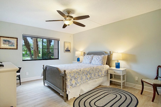 bedroom featuring light hardwood / wood-style floors and ceiling fan