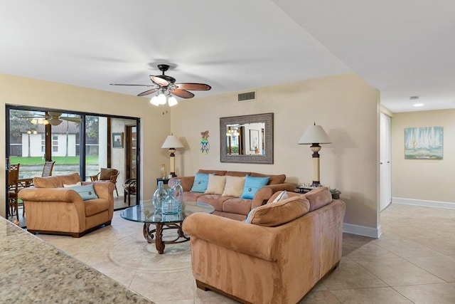 tiled living room with ceiling fan