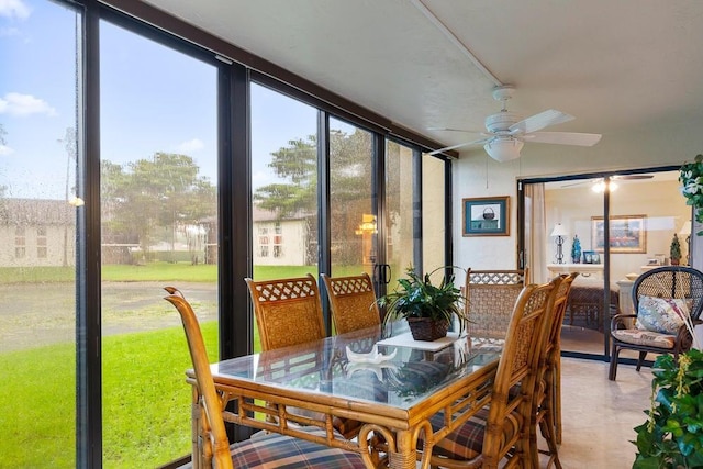 sunroom / solarium featuring ceiling fan