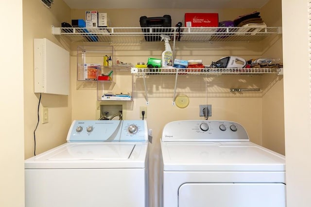 laundry room with washing machine and dryer