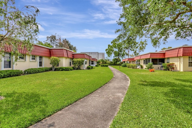 view of home's community featuring a yard