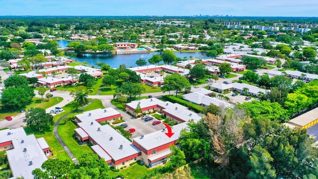 birds eye view of property featuring a water view