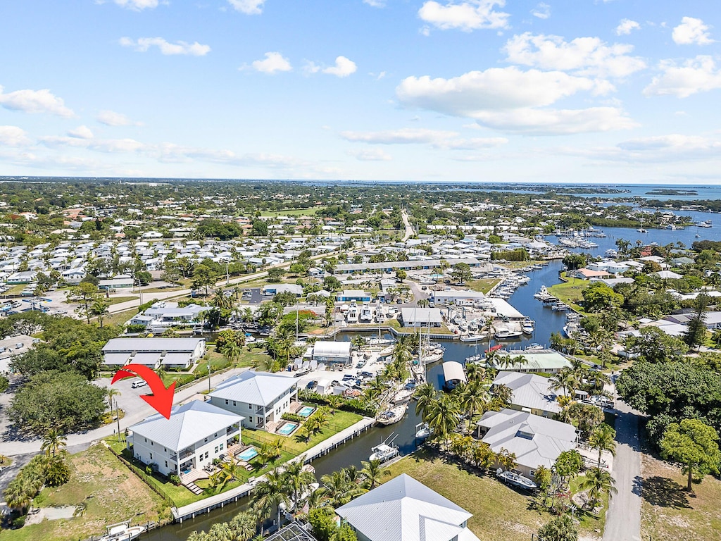 birds eye view of property with a water view