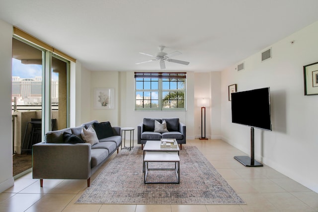 tiled living room featuring ceiling fan