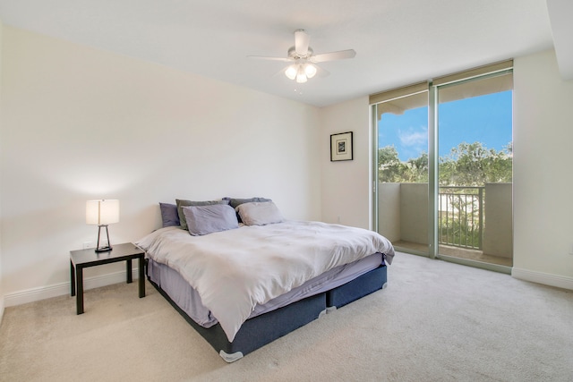 bedroom with light colored carpet, access to outside, and ceiling fan