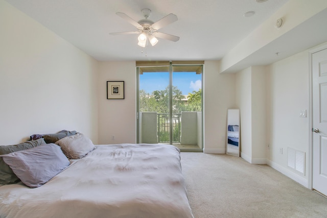 carpeted bedroom with ceiling fan and access to exterior