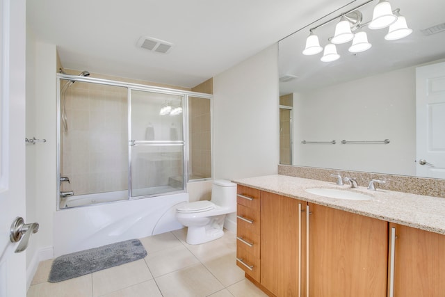 full bathroom with combined bath / shower with glass door, toilet, vanity, and tile flooring