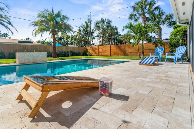 view of pool with a patio area, a fenced backyard, and a fenced in pool