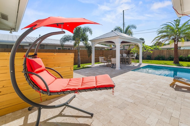 exterior space with a fenced backyard, a fenced in pool, a patio, and a gazebo