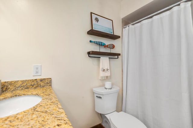 bathroom featuring toilet and a sink