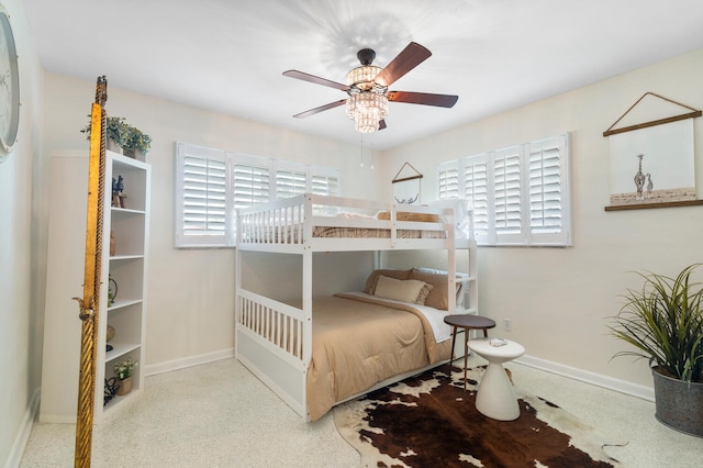 bedroom with baseboards and light speckled floor