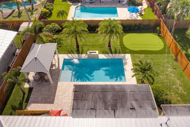 view of swimming pool with a patio area, a fenced backyard, and a gazebo