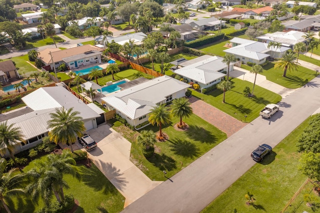 birds eye view of property with a residential view