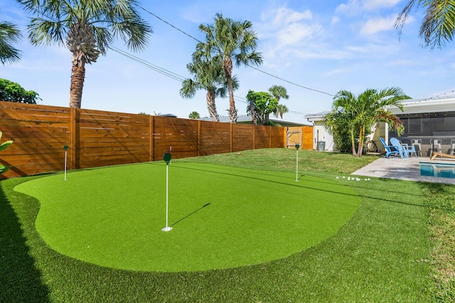 view of community featuring a fenced backyard and a patio