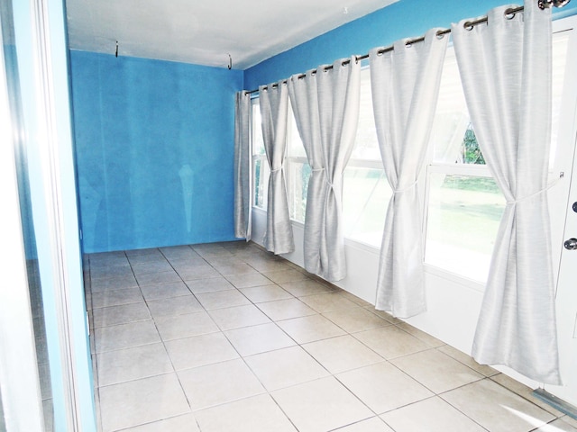 empty room with light tile floors