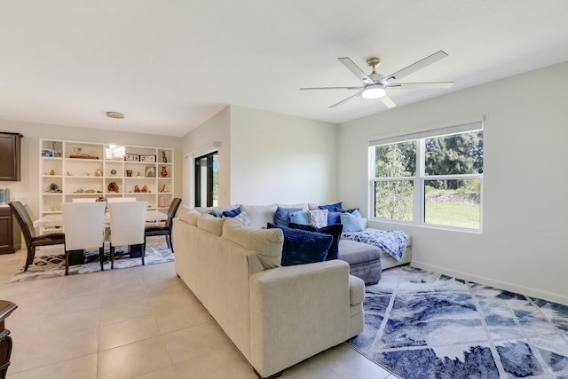 living room featuring ceiling fan and light tile floors