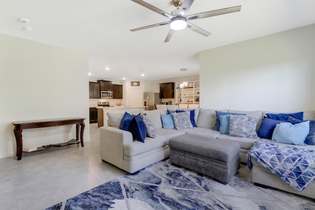 tiled living room with ceiling fan