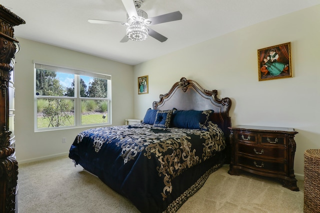 bedroom with light carpet and ceiling fan