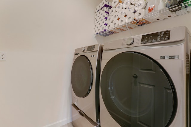 laundry area with washing machine and dryer