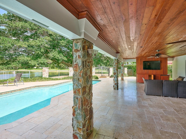 view of swimming pool with a patio, an outdoor living space, and ceiling fan